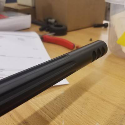 Timed muzzle brake on fluted and threaded barrel